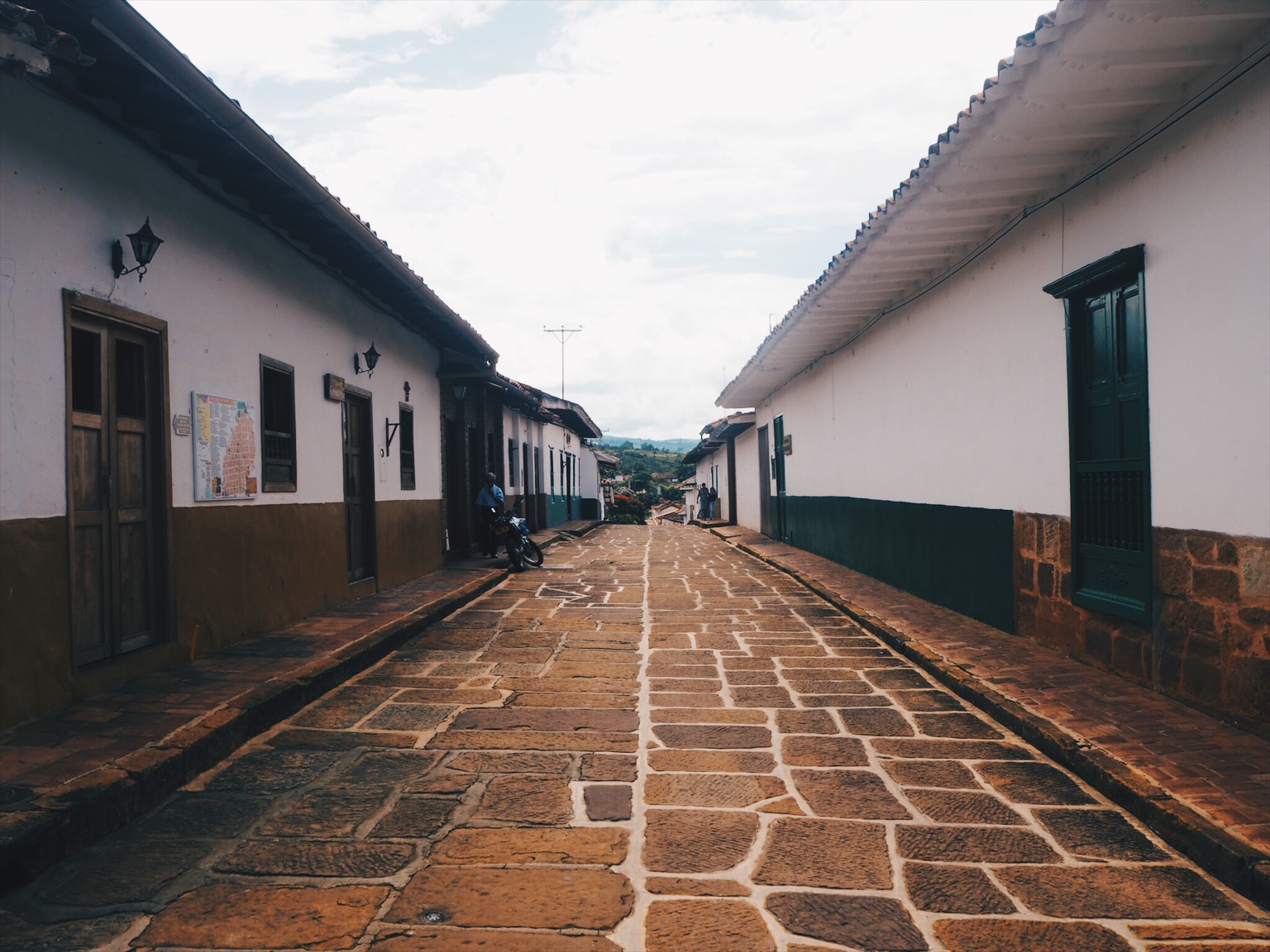 Empty colonial street with white buildings