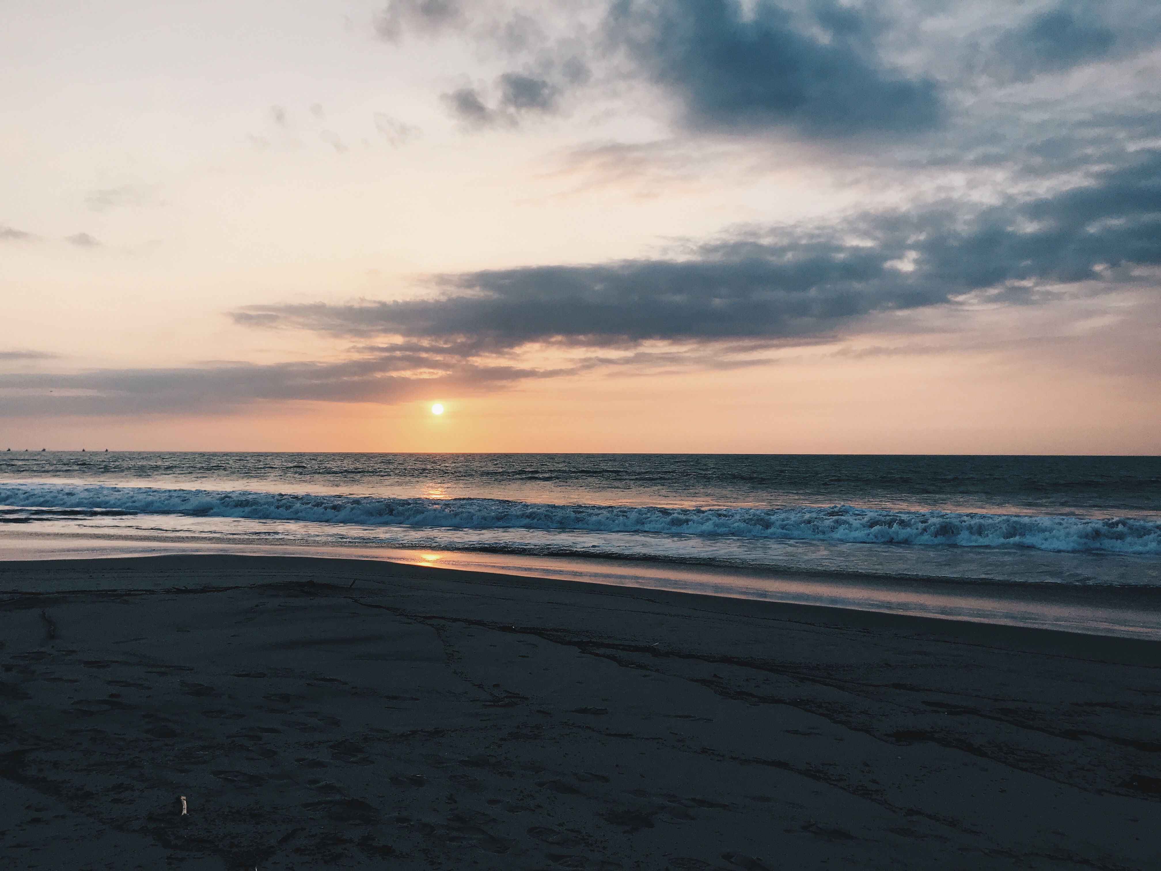 Sunset over sand beach in Mancora, Peru